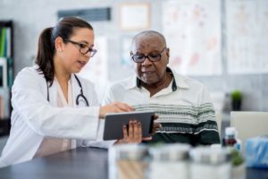 Doctor and patient looking at device